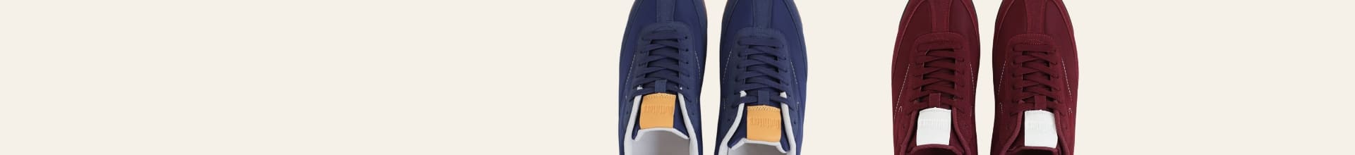 Two pairs of shoes, one blue and one red, on a white background.