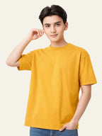Person wearing a yellow t-shirt against a plain background Plain Colourful T-Shirt Royal Outfits Plain T-Shirts