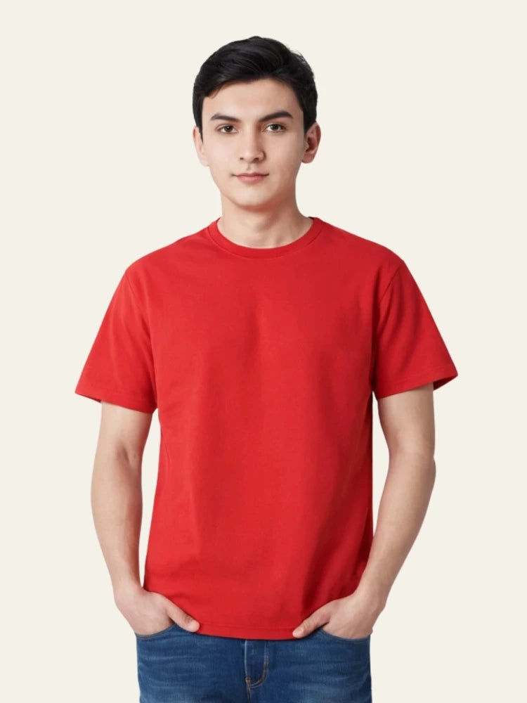Person wearing a red t-shirt on a plain background Plain Colourful T-Shirt Royal Outfits Plain T-Shirts