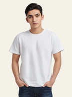 Person wearing a plain white t-shirt against a light background Plain Colourful T-Shirt Royal Outfits Plain T-Shirts