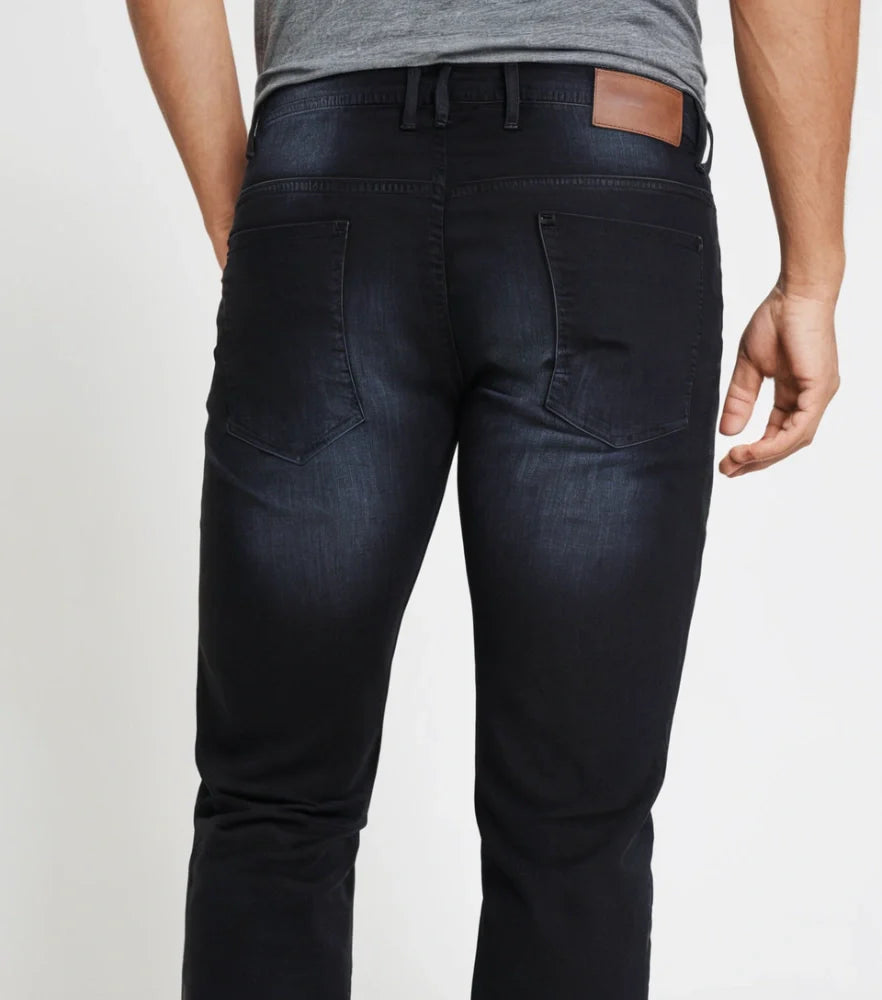 Model wearing slim straight-fit jeans made with stretchable cotton lycra fabric, light blue wash - Royal Outfits Straight Jeans with Cotton Lycra Royal Outfits Jeans