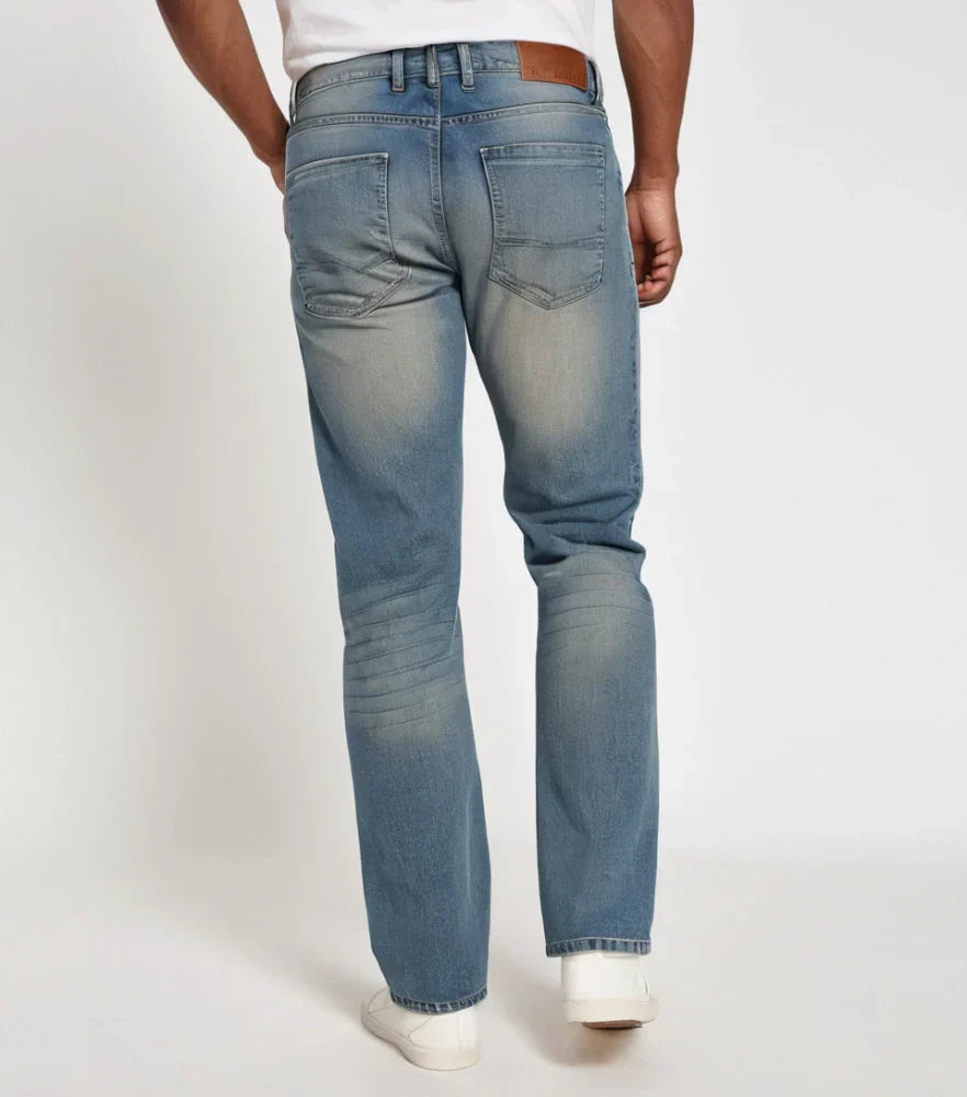 Front view of a model wearing classic blue straight-leg jeans with a clean hem and medium wash - Royal Outfits Classic Straight Jeans Royal Outfits Jeans - Classic Straight Jeans - Royal Outfits - Jeans - Classic Straight Jeans - Royal Outfits