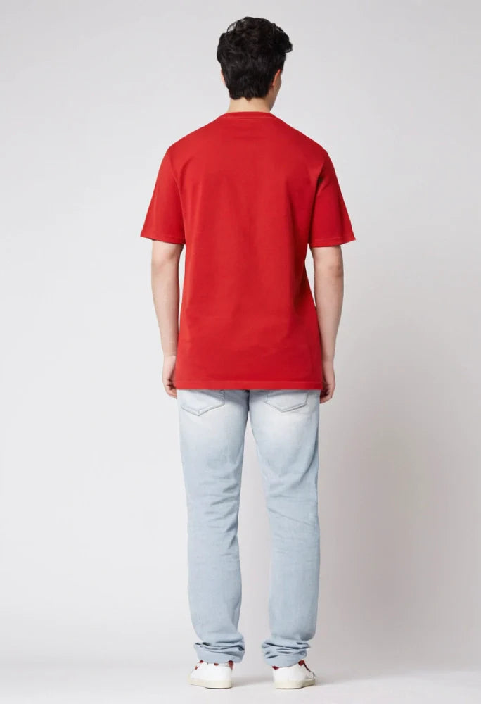 Person wearing a red polo shirt and light blue jeans on a white background Graphic Red Ace T-Shirt Royal Outfits Graphic T Shirts