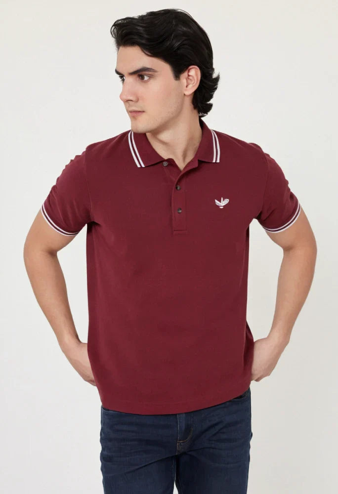 Man wearing a maroon polo shirt with a logo on a white background Maroon Quoted Regular Fit Men’s Polo T-Shirt Royal Outfits POLO T Shirts - Maroon Quoted Regular Fit Men’s Polo T-Shirt - Royal Outfits - POLO T Shirts