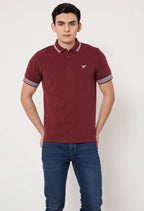 Man wearing a maroon polo shirt with a small logo on a white background Maroon Quoted Regular Fit Men’s Polo T-Shirt Royal Outfits POLO T Shirts