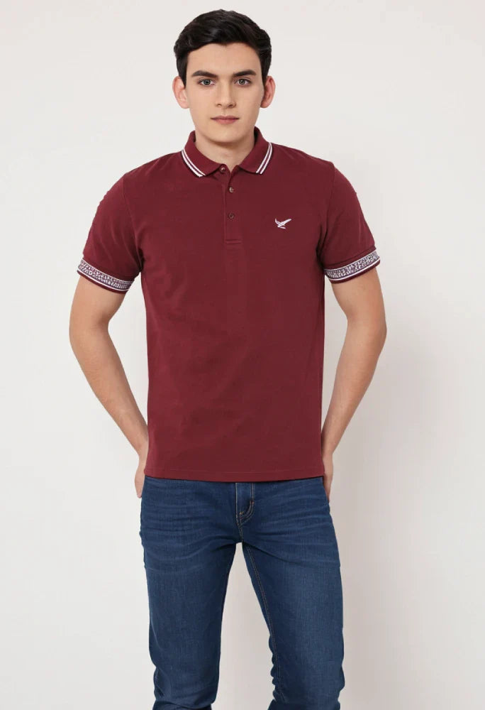 Man wearing a maroon polo shirt with a small logo on a white background Maroon Quoted Regular Fit Men’s Polo T-Shirt Royal Outfits POLO T Shirts