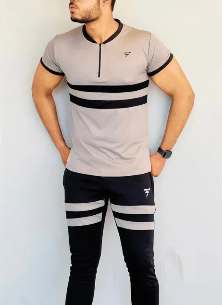 Model dressed in a beige full-sleeve track suit with a front zip and matching joggers - Royal Outfits Beige Track Suit for Men Royal Outfits Track Suits - Beige Track Suit for Men - Royal Outfits - Track Suits - Beige Track Suit for Men - Royal Outfits
