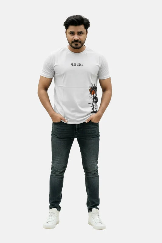Man wearing a white t-shirt with graphics and text, black jeans, and white sneakers on a beige background Graphic White Palm T-Shirt Royal Outfits Graphic T Shirts - Graphic White Palm T-Shirt - Royal Outfits - Graphic T Shirts - Graphic White Palm T-Shirt - Royal Outfits