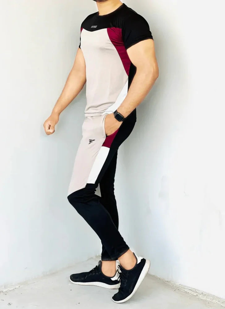 Gray Diamond-patterned track suit featuring a fitted jacket and tapered pants, styled on a male model - Royal Outfits Diamond Track Suit Royal Outfits Track Suits