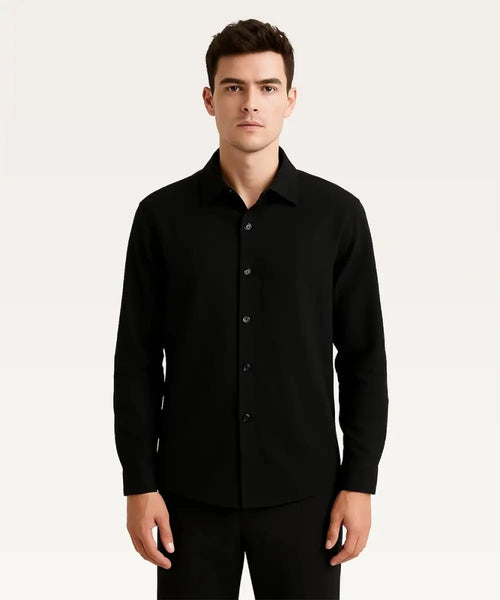 Man wearing a black button-up shirt against a white background Basic Cotton Shirt Royal Outfits Plain Shirts - Basic Cotton Shirt - Royal Outfits - Plain Shirts - Basic Cotton Shirt - Royal Outfits