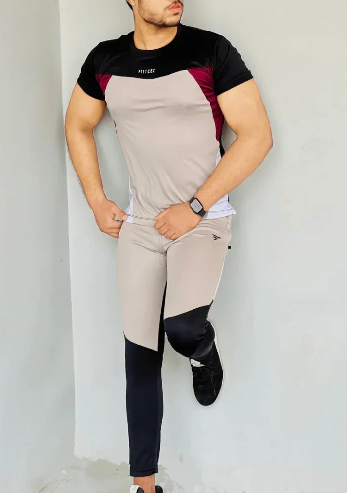 Gray Diamond-patterned track suit featuring a fitted jacket and tapered pants, styled on a male model - Royal Outfits Diamond Track Suit Royal Outfits Track Suits