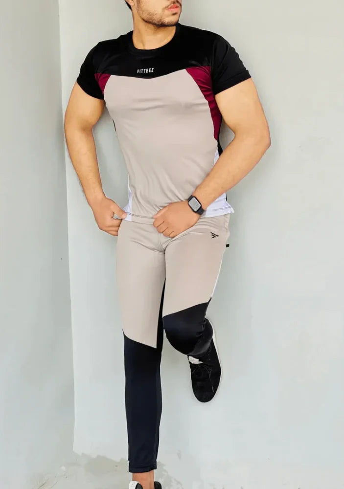 Gray Diamond-patterned track suit featuring a fitted jacket and tapered pants, styled on a male model - Royal Outfits Diamond Track Suit Royal Outfits Track Suits - Diamond Track Suit - Royal Outfits - Track Suits - Diamond Track Suit - Royal Outfits
