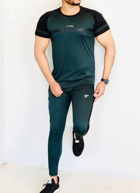 Person wearing a green and black athletic outfit with visible branding on a white background Pro-Fit Track Suit Royal Outfits Track Suits - Pro-Fit Track Suit - Royal Outfits - Track Suits - Pro-Fit Track Suit - Royal Outfits
