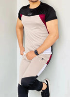 Gray Diamond-patterned track suit featuring a fitted jacket and tapered pants, styled on a male model - Royal Outfits Diamond Track Suit Royal Outfits Track Suits