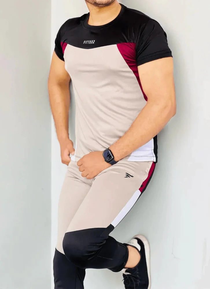 Gray Diamond-patterned track suit featuring a fitted jacket and tapered pants, styled on a male model - Royal Outfits Diamond Track Suit Royal Outfits Track Suits