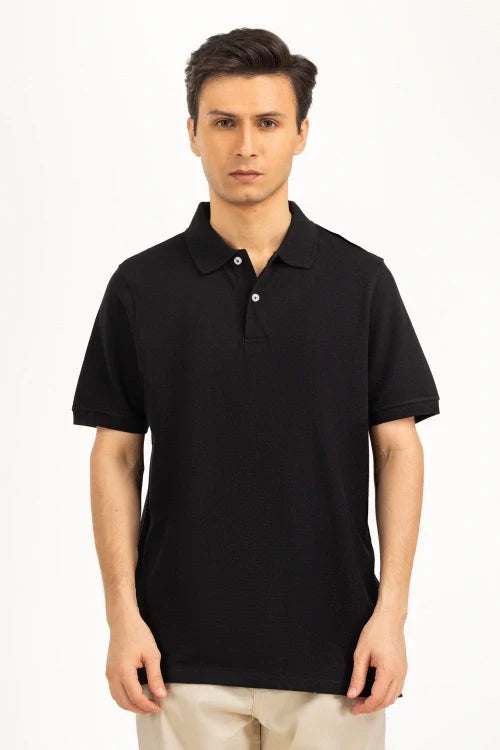 Man wearing a black polo shirt on a white background Black Regular Fit Men POLO T-Shirt Royal Outfits POLO T Shirts