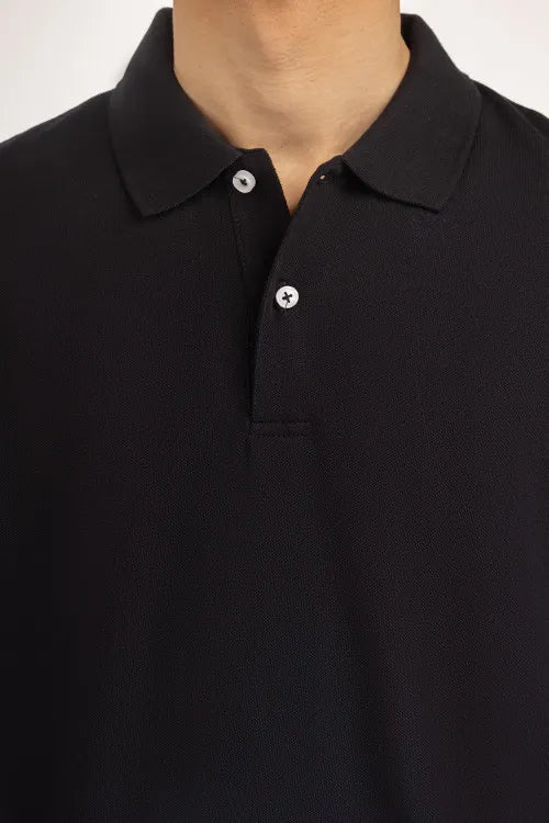 Close-up of a black polo shirt with a plain background Black Regular Fit Men POLO T-Shirt Royal Outfits POLO T Shirts