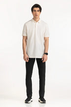 Man wearing a white polo shirt and black pants on a white background White Regular Fit Men POLO T-Shirt Royal Outfits POLO T Shirts