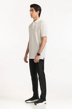 Man wearing a white polo shirt and black pants on a white background White Regular Fit Men POLO T-Shirt Royal Outfits POLO T Shirts