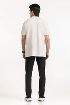 Person wearing a white polo shirt and black pants on a white background White Regular Fit Men POLO T-Shirt Royal Outfits POLO T Shirts