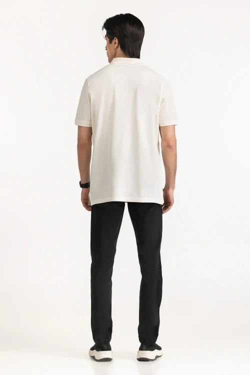 Person wearing a white polo shirt and black pants on a white background White Regular Fit Men POLO T-Shirt Royal Outfits POLO T Shirts