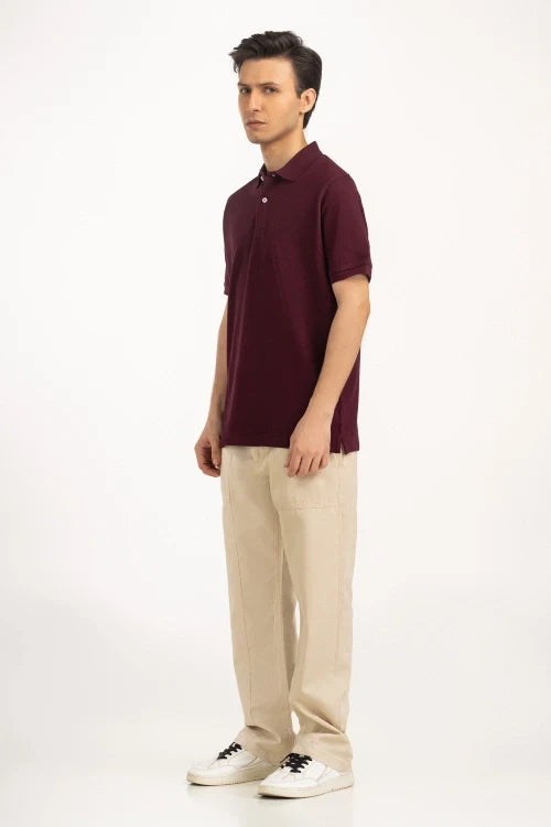 Man wearing a maroon polo shirt and beige pants on a white background Maroon Regular Fit Men POLO T-Shirt Royal Outfits POLO T Shirts