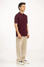 Man wearing a maroon polo shirt and beige pants on a white background Maroon Regular Fit Men POLO T-Shirt Royal Outfits POLO T Shirts