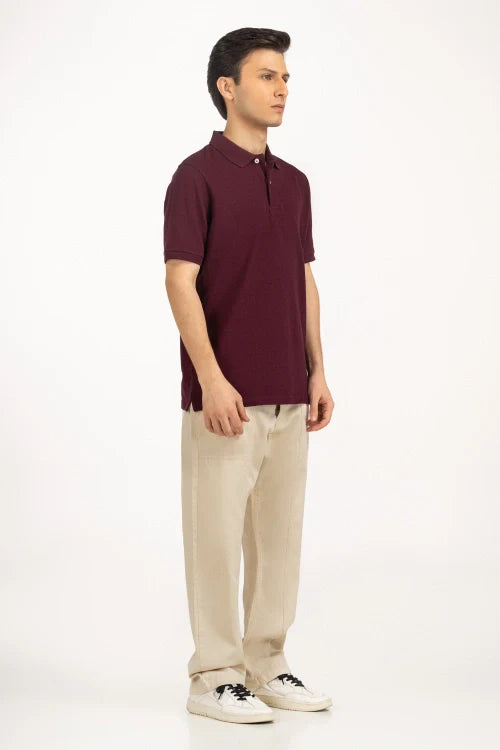 Man wearing a maroon polo shirt and beige pants on a white background Maroon Regular Fit Men POLO T-Shirt Royal Outfits POLO T Shirts