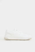 White sneaker on a light gray background Low Top Sneakers Royal Outfits Sneakers - Low Top Sneakers - Royal Outfits - Sneakers - Low Top Sneakers - Royal Outfits