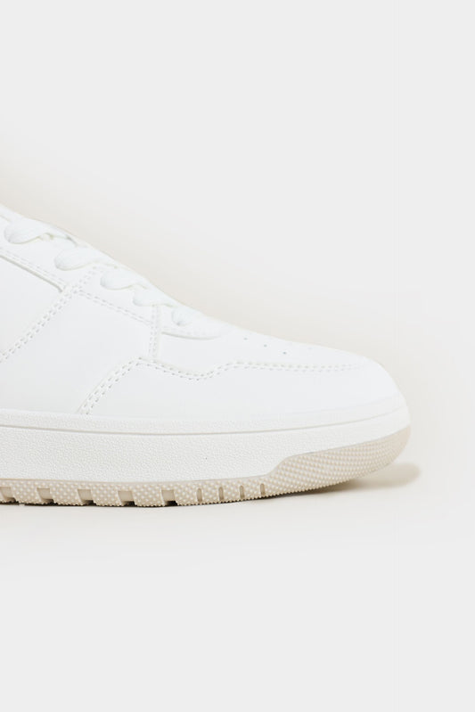 White sneaker on a light beige background Low Top Sneakers Royal Outfits Sneakers