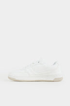 White sneaker on a light gray background Low Top Sneakers Royal Outfits Sneakers