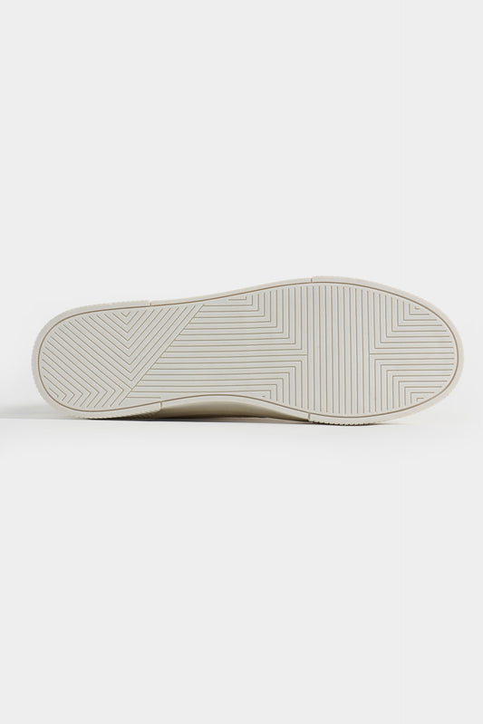 Close-up of a white sneaker sole on a light gray background Multi Low Top Sneakers Royal Outfits Sneakers