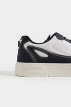 Black and white sneaker on a light gray background Multi Low Top Sneakers Royal Outfits Sneakers