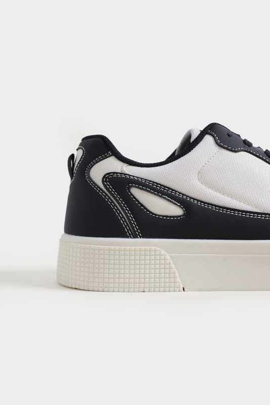Black and white sneaker on a light gray background Multi Low Top Sneakers Royal Outfits Sneakers