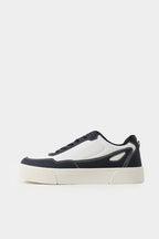 Black and white sneaker on a light gray background Multi Low Top Sneakers Royal Outfits Sneakers