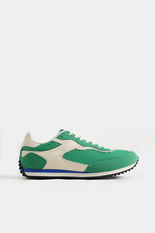 Green and beige sneaker on a white background