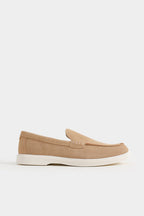 Beige loafer shoe on a white background Suede Loafers Royal Outfits Loafers