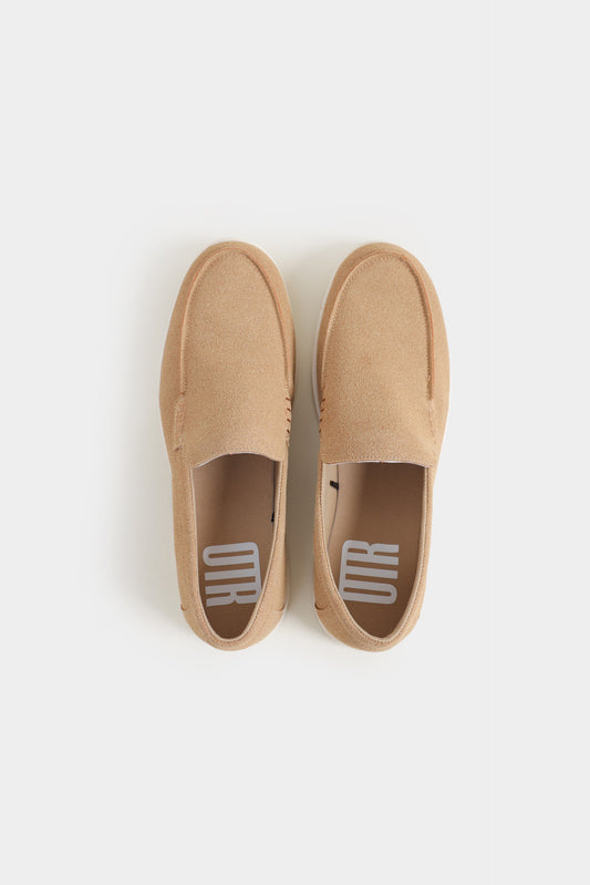 Pair of tan slip-on shoes on a white background Suede Loafers Royal Outfits Loafers