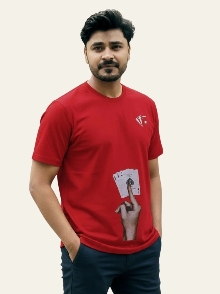Man wearing a red t-shirt with a graphic design on a plain background Graphic Red Ace T-Shirt Royal Outfits Graphic T Shirts