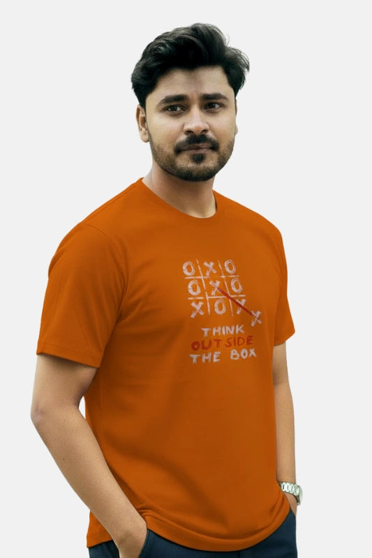 Man wearing an orange t-shirt with text on a plain background Graphic Orange Crossword T-Shirt Royal Outfits Graphic T Shirts - Graphic Orange Crossword T-Shirt - Royal Outfits - Graphic T Shirts