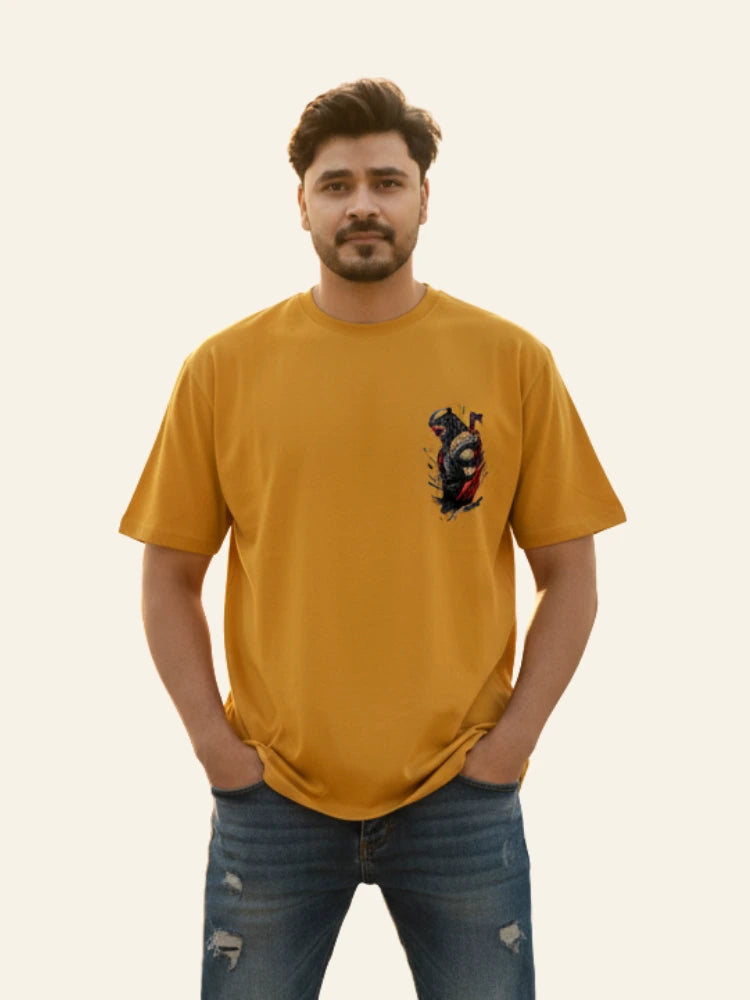 Man wearing a mustard yellow t-shirt with a graphic design on a plain background Graphic Mustard/Yellow Drop Shoulder Axe Man T-Shirt Royal Outfits Drop Shoulder T-Shirts
