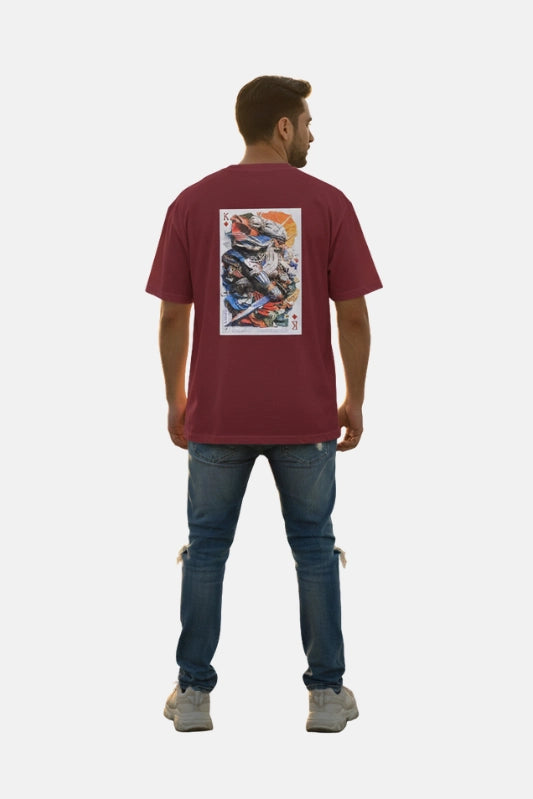 Man wearing a maroon t-shirt with a graphic design on the back, standing against a plain background. Graphic Maroon Drop Shoulder King Ace T-Shirt Royal Outfits Drop Shoulder T-Shirts - Graphic Maroon Drop Shoulder King Ace T-Shirt - Royal Outfits - Drop Shoulder T-Shirts
