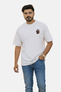 Man wearing a white t-shirt with a logo on a beige background Graphic White Drop Shoulder "Dhool" T-Shirt Royal Outfits Drop Shoulder T-Shirts