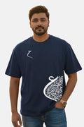 Man wearing a navy blue t-shirt with white designs on a plain background Graphic Navy Blue Drop Shoulder Calligraphy T-Shirt Royal Outfits Drop Shoulder T-Shirts