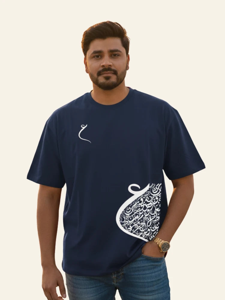 Man wearing a navy blue t-shirt with white designs on a plain background Graphic Navy Blue Drop Shoulder Calligraphy T-Shirt Royal Outfits Drop Shoulder T-Shirts