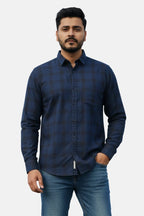 Man wearing a blue checkered shirt against a plain background - Men’s Royal Blue Check Shirt - Royal Outfits - Check Shirts - Men’s Royal Blue Check Shirt - Royal Outfits