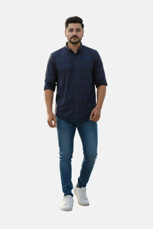 Man wearing a navy blue shirt and jeans on a plain background - Men’s Royal Blue Check Shirt - Royal Outfits - Check Shirts - Men’s Royal Blue Check Shirt - Royal Outfits