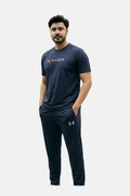 Man wearing a navy Under Armour t-shirt and pants on a white background Navy Blue ‘Under Armour’ Tracksuit Royal Outfits Track Suits