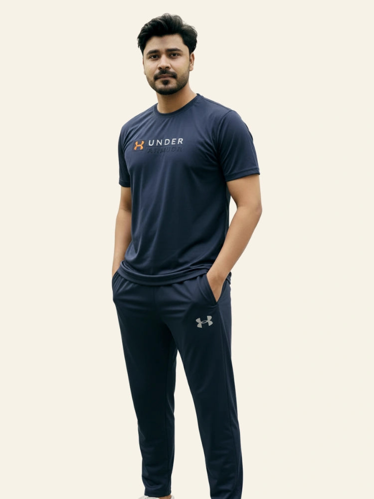 Man wearing a navy Under Armour t-shirt and pants on a white background Navy Blue ‘Under Armour’ Tracksuit Royal Outfits Track Suits