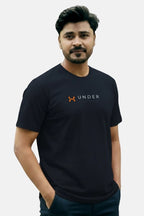 Man wearing a black Under Armour t-shirt against a plain background Navy Blue ‘Under Armour’ Tracksuit Royal Outfits Track Suits - Navy Blue ‘Under Armour’ Tracksuit - Royal Outfits - Track Suits